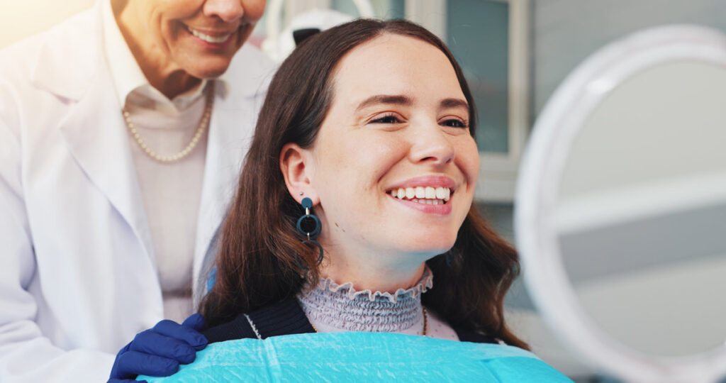 Teeth, smile and mirror with woman at dentist for dental care, treatment and fresh breath. Cleaning, tooth whitening and happy person for oral hygiene, orthodontics or wellness with veneer inspection.