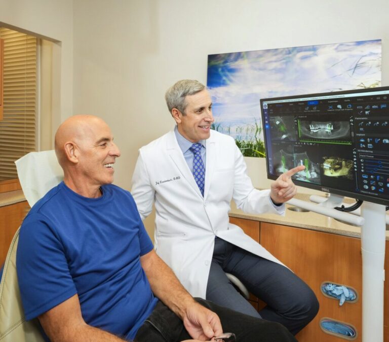 Dr. Laudenbach with patient 1024x898 1 - Periodontist Philadelphia | Laudenbach Periodontics & Dental Implants