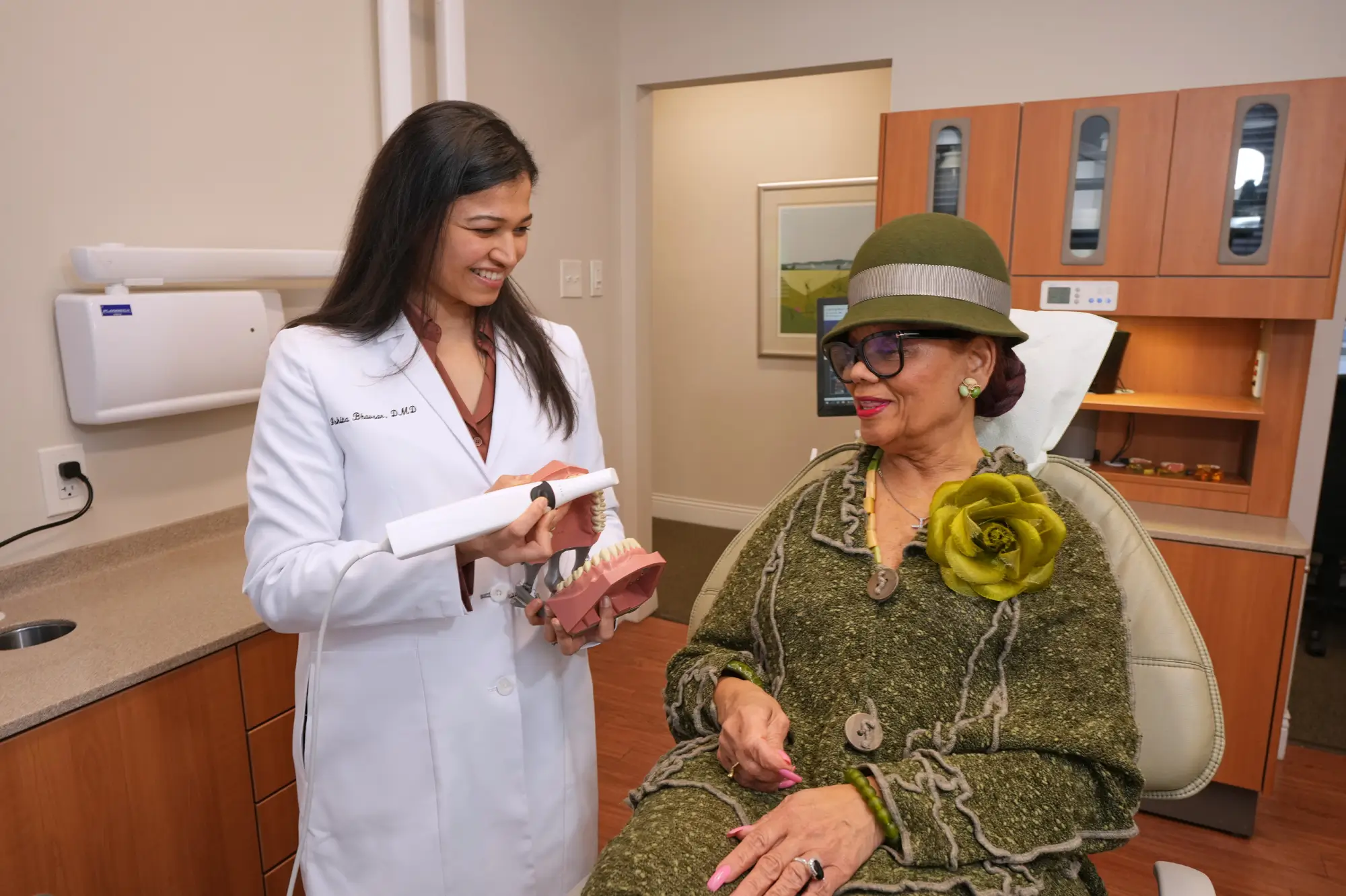 Periodontist consulting with patient about gum recession treatment in Philadelphia