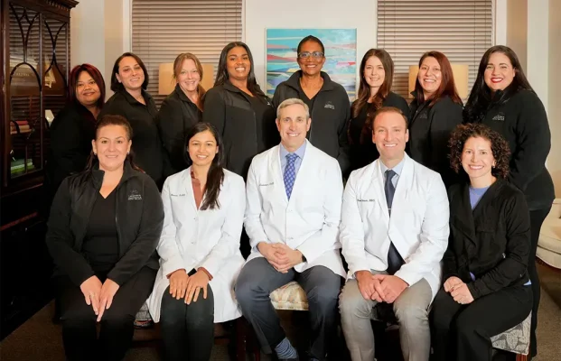 Laudenbach Periodontics & Dental Implants full team group portrait with doctors and staff